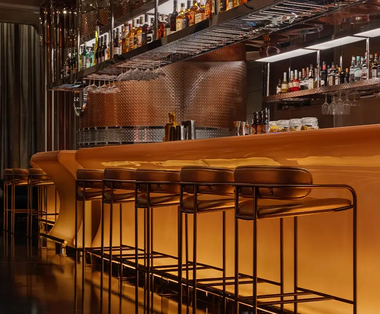 http://Golden%20illuminated%20bar%20counter%20with%20stools