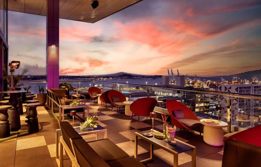 http://Hiso%20Rooftop%20bar%20outdoor%20seating%20area%20during%20sunset