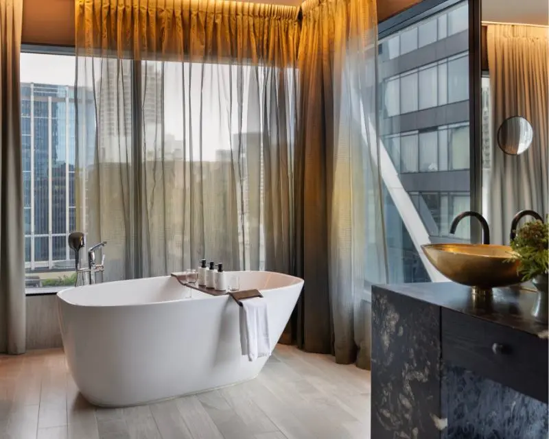http://Bathroom%20at%20SO/%20Auckland%20with%20a%20freestanding%20bathtub%20and%20golden%20sink.