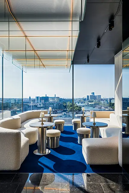 http://Blue%20and%20white%20colour%20scheme%20characterises%20a%20bar%20with%20floor-to-ceiling%20windows.