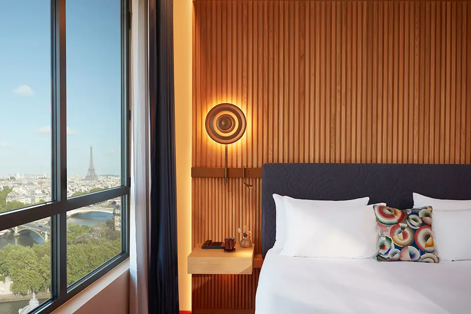 http://Bedside%20with%20views%20over%20Paris%20with%20Eiffel%20tower%20visible.