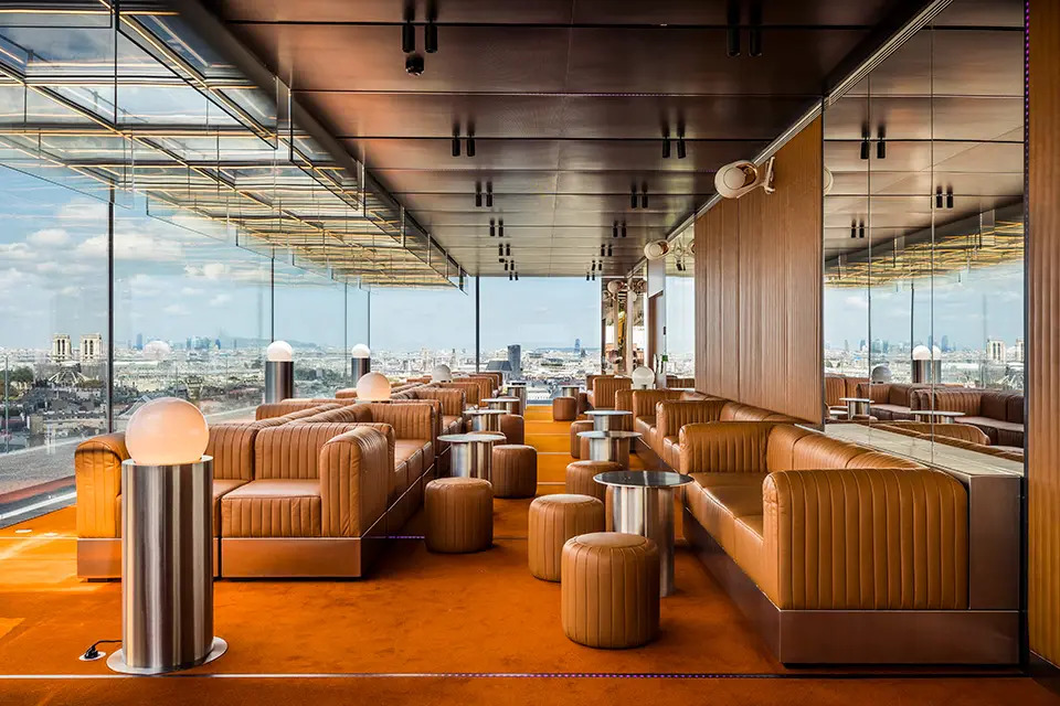 http://Glass-walled%20bar%20area%20contains%20soft%20leather%20sofas.
