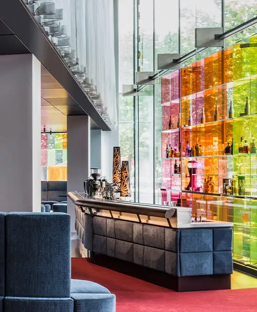 http://A%20bar%20with%20a%20multicoured%20drinks%20shelf