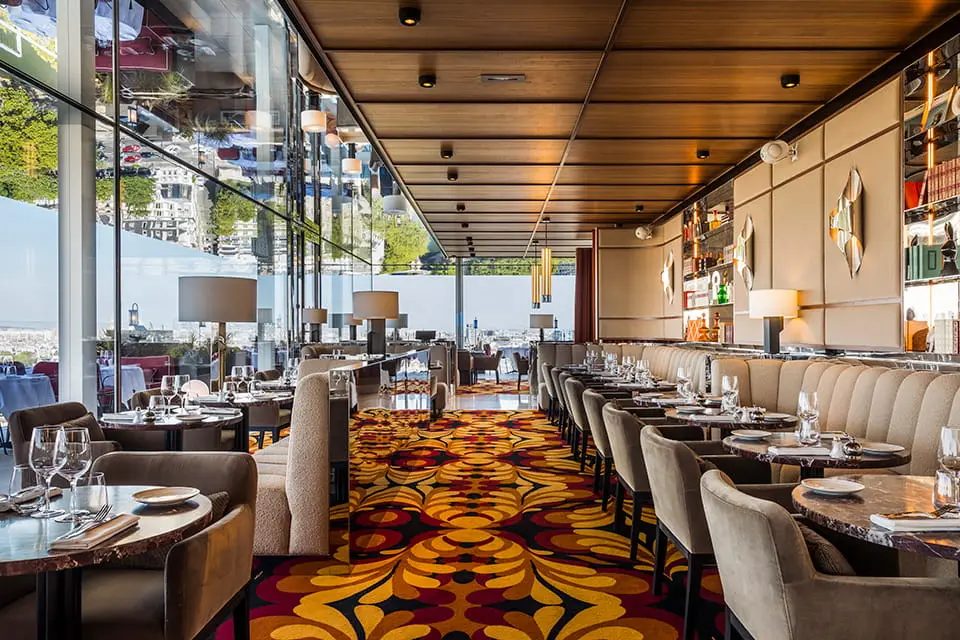 http://Sunlit%20terrace%20bar%20with%20brightly%20patterned%20carpet.
