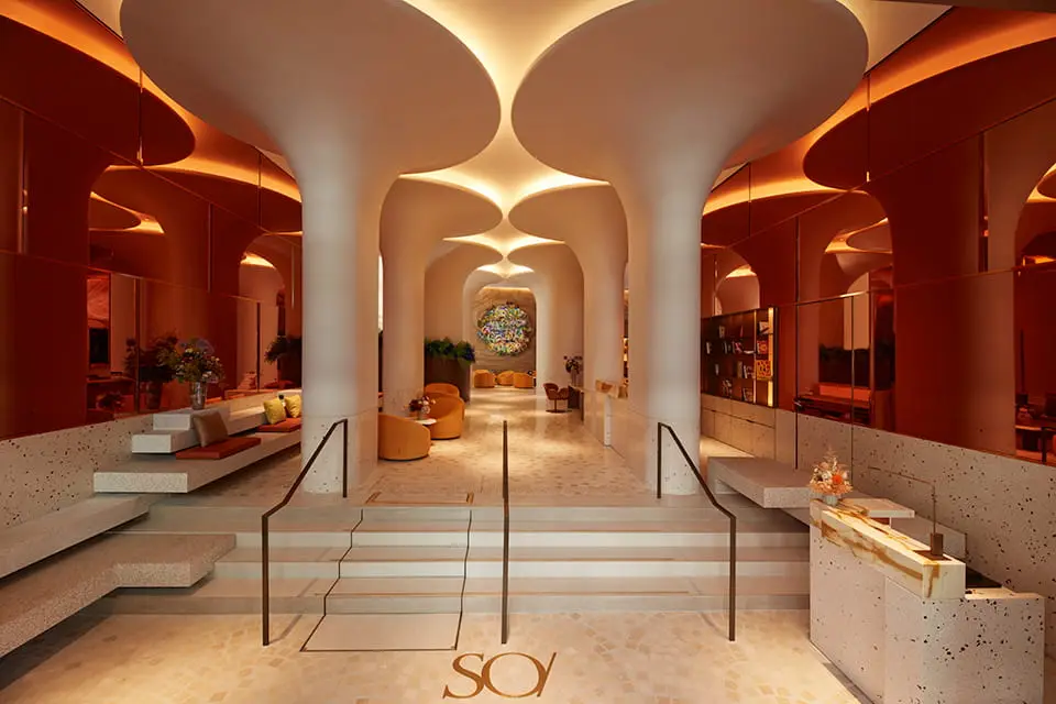 http://Architecture%20inside%20the%20hotel%20featuring%20columns%20with%20trumpet-like%20heads.