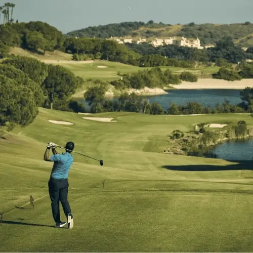 http://A%20man%20swings%20a%20golf%20club%20on%20a%20lush%20green%20course,%20focusing%20intently%20on%20his%20shot.