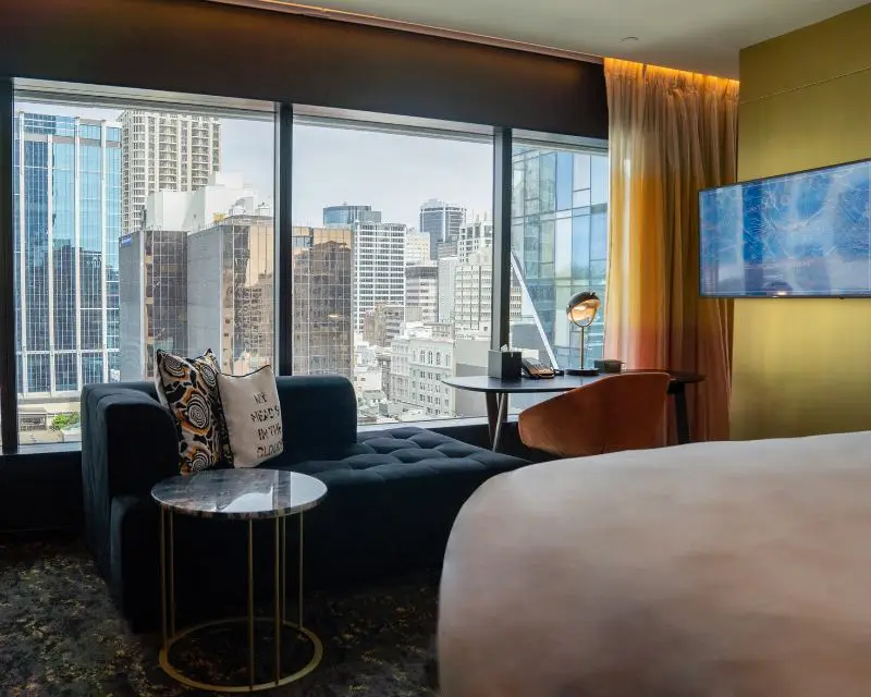 http://Living%20area%20of%20hotel%20room%20at%20SO/%20Auckland%20with%20view%20to%20the%20city