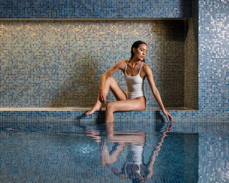 http://A%20person%20next%20to%20the%20pool%20at%20SO/%20Spa